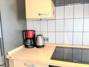 a coffee maker on a counter in a kitchen at Apartment Ferienapartments Adenau-3 by Interhome in Adenau +19 photos