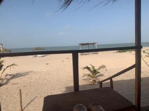a view of the beach from a balcony of a beach at Bosofet Beach and Creek Lodge in Sanyang