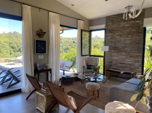 a living room with a stone wall at Casa Soliá in Lules