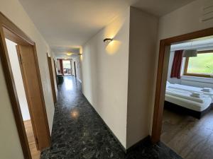 a hallway with a room with a bed and a window at Apartment Max by Interhome in Stams