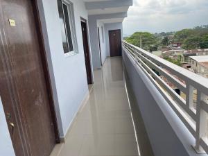 a balcony with a view of a city at Mi lugar de descanso in Moca