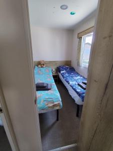 G & M Static Caravan Edinburgh客房内的一张或多张床位