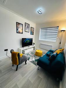 Μια τηλεόραση ή/και κέντρο ψυχαγωγίας στο Cozy Haven Your Perfect 1Bed LE2