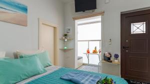 Postel nebo postele na pokoji v ubytování Apolafsi Apartments 2 New with kitchen