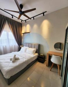 a bedroom with a bed and a ceiling fan at 2 bedroom apartment 5 people in Nilai