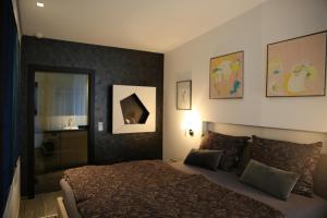 Posteľ alebo postele v izbe v ubytovaní Apartment SunBox