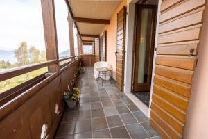 a balcony of a house with a table and chairs at RESIDENCE SERRADA in Serrada