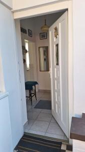 a hallway with a door leading into a room at Sissi Residence with free parking lot in Budapest +27 photos