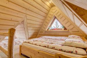 Posteľ alebo postele v izbe v ubytovaní Apartamenty Stylowe Zakopane