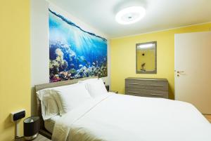 En eller flere senge i et værelse på Bellagio Beautiful Oasi