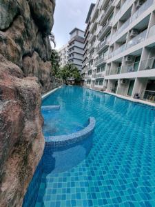 Bazén v ubytování Laguna beach condo resort 3 maldives pattaya pool view ลากูน่า บีช คอนโด รีสอร์ต 3 พัทยา nebo v jeho okolí