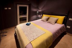 Postel nebo postele na pokoji v ubytování Residenza Lucio Alfio