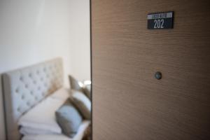 Postel nebo postele na pokoji v ubytování Residenza Lucio Alfio