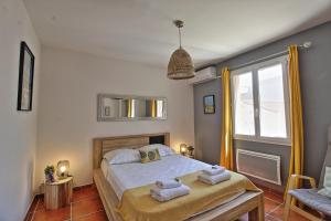 Posteľ alebo postele v izbe v ubytovaní Charmante maison de vacances près de Nîmes