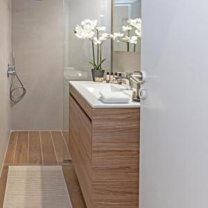 a bathroom with a sink and a mirror at Cozy Apartment in Kallithea in Athens