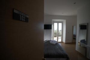 Postel nebo postele na pokoji v ubytování Residenza Lucio Alfio