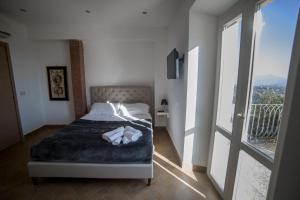 Postel nebo postele na pokoji v ubytování Residenza Lucio Alfio