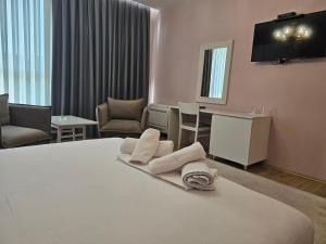 Postel nebo postele na pokoji v ubytování Hotel 3A