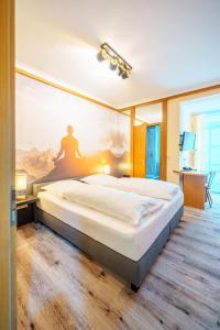 Postel nebo postele na pokoji v ubytování Hotel Plankl