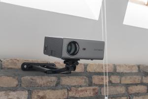 a security camera attached to a brick wall at Sleepway Apartment - Marina in Poznań