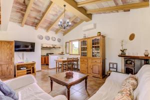 a living room with a couch and a table at Finca Padre by Rentallorca in Son Servera
