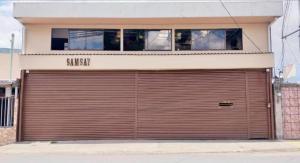 a large garage door on the side of a building at Apartamento SamSay II in Cartago