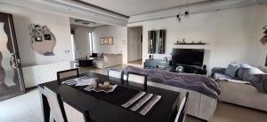 a living room with a table and a couch at Rhodian Villa in Kremasti