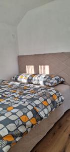 Postel nebo postele na pokoji v ubytování Apartments Bajceta