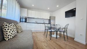 a kitchen and dining room with a table and chairs at Apartment Zore in Promajna