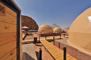 a view of domes in the desert from a building at Panorama Luxury Camp in Wadi Rum