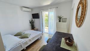 Postel nebo postele na pokoji v ubytování Apartment Zore