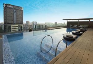 a swimming pool on the roof of a building at Liberty Central Saigon Citypoint in Ho Chi Minh City