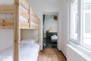Postel nebo postele na pokoji v ubytování Right In The City Center Your Ghent Getaway
