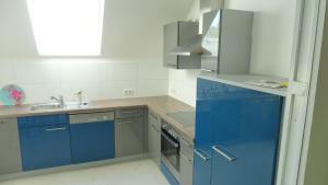 A kitchen or kitchenette at Apartment Vindobona