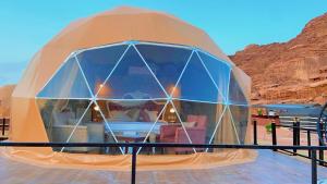 a dome house in the middle of the desert at Faisal Wadi Rum camp in Wadi Rum