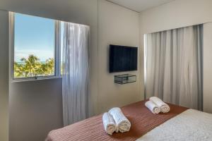 Postel nebo postele na pokoji v ubytování Hotel Costamar Ponta Verde
