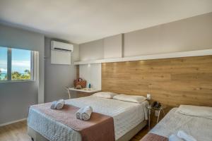 Postel nebo postele na pokoji v ubytování Hotel Costamar Ponta Verde