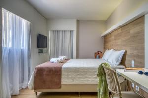 Postel nebo postele na pokoji v ubytování Hotel Costamar Ponta Verde