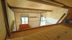 a view of a bird cage in a bedroom at A Cabaña do Cumiar in Ponteareas