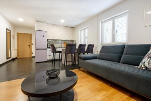 a living room with a couch and a table at Villa Marina in Slano