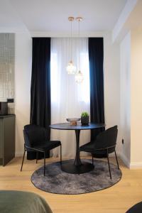 a dining room table and chairs in a room at Candy Ballerina No 4 Lux Zagreb Center - top positon in Zagreb