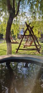 a park with a tree and a picnic table at GreenField Luxe in Yeghegnadzor