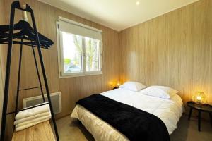 Una cama o camas en una habitación de Lodge Loua