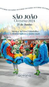 un póster para un espectáculo con dos mujeres con disfraces coloridos en Oceana Atlântico Hotel, en João Pessoa