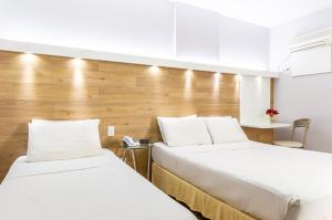 Postel nebo postele na pokoji v ubytování Hotel Costamar Ponta Verde