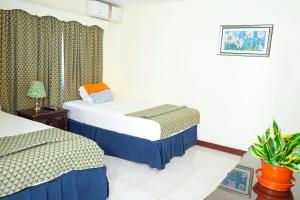 Letto o letti in una camera di AYURVEDA RESORT
