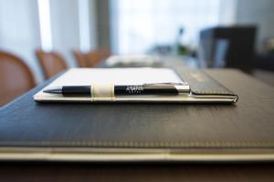 a pen sitting on top of a table at Atana Hotel in Dubai