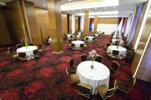 a row of tables and chairs in a room at Atana Hotel in Dubai