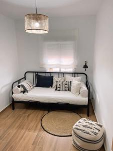 Een bed of bedden in een kamer bij Apartamento Boho Chic