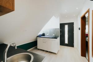 Η κουζίνα ή μικρή κουζίνα στο Apart House Karwia LOFT 85m2 +4 φωτογραφίες